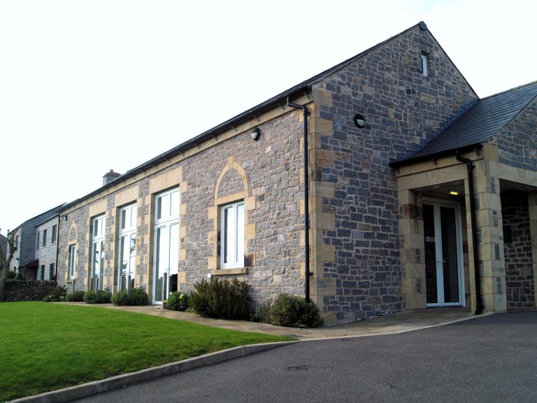 Large modern stone building.